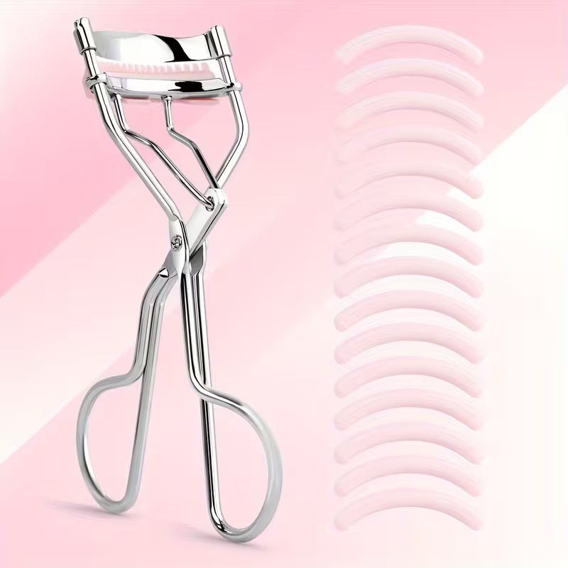 Silver stainless steel eyelash curler with 15 replacement pads on pink background